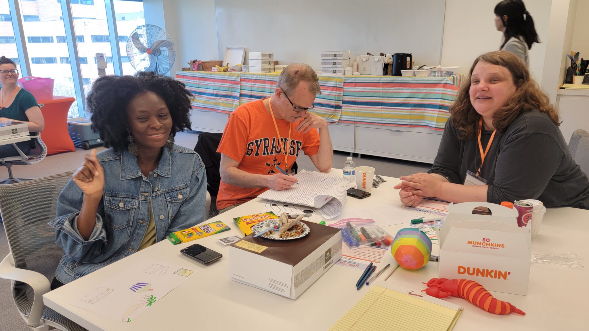 Students work together at a table in the I-3 center at “Springboard: The Newhouse Academic Un-conference”