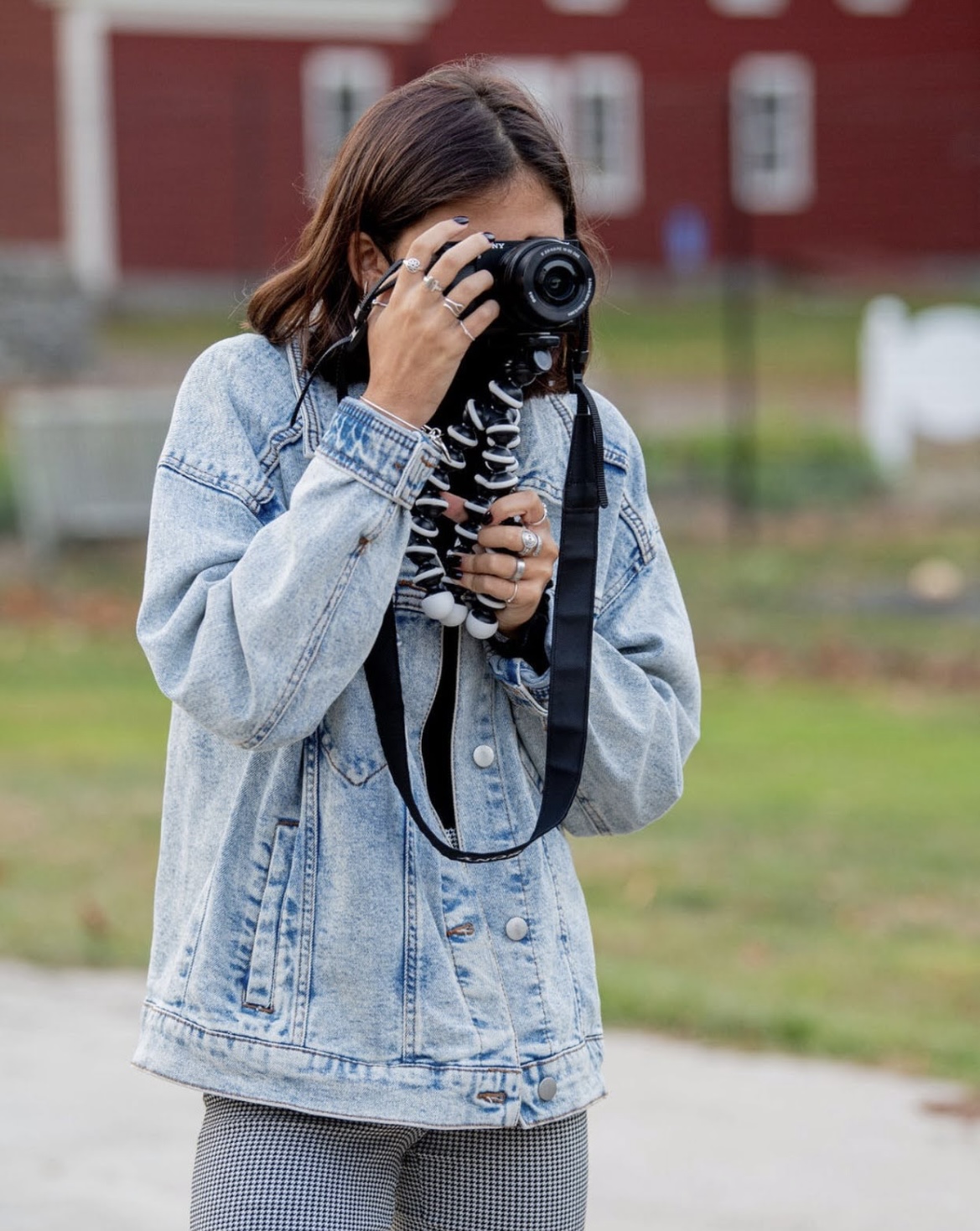 a girl holds a camera and films