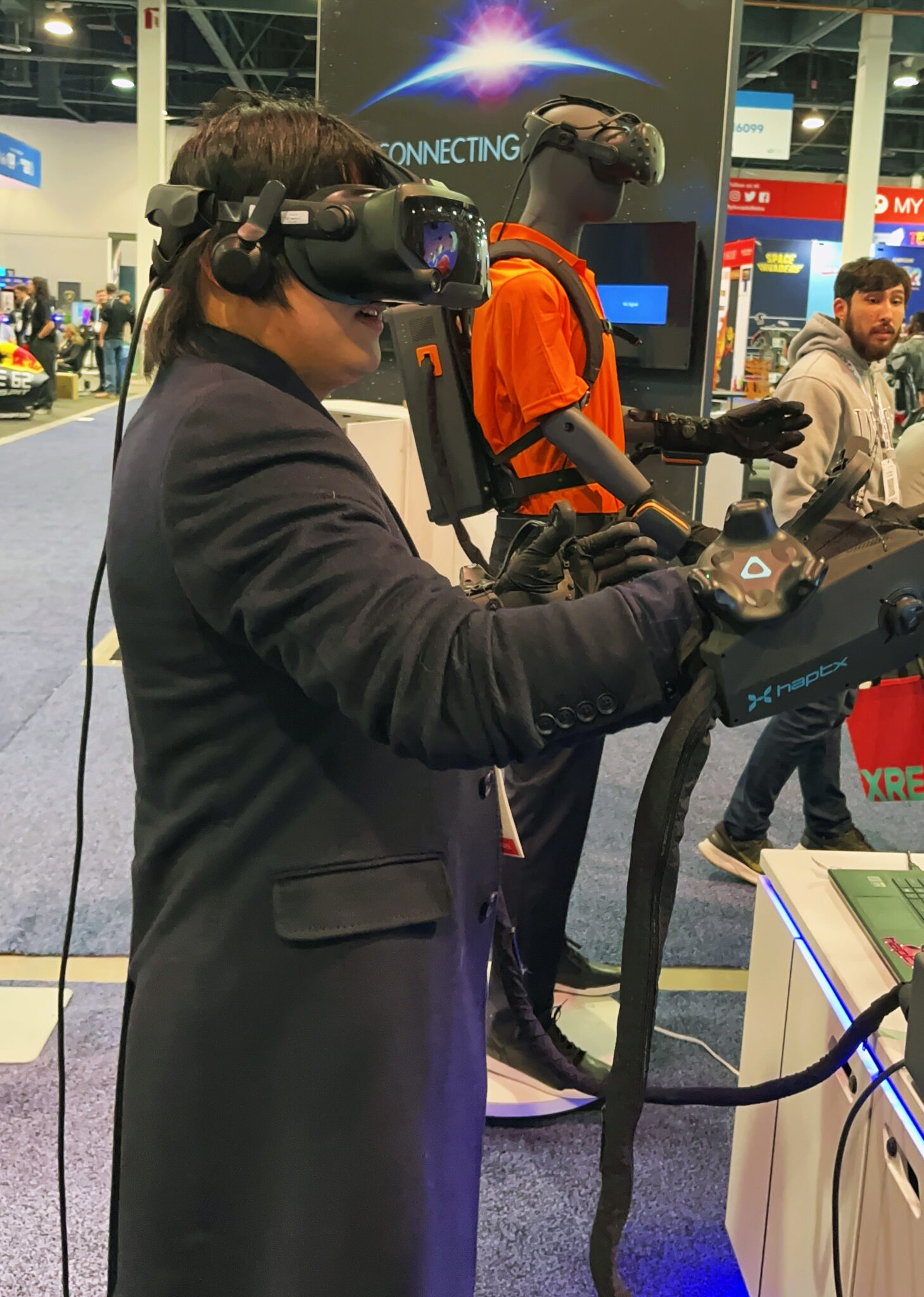 a person participates in a demo of a haptic virtual reality experience.