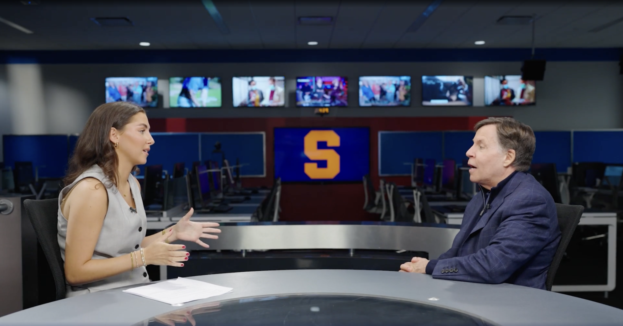 Chloe Smarz interviews Bob Costas in a newsroom