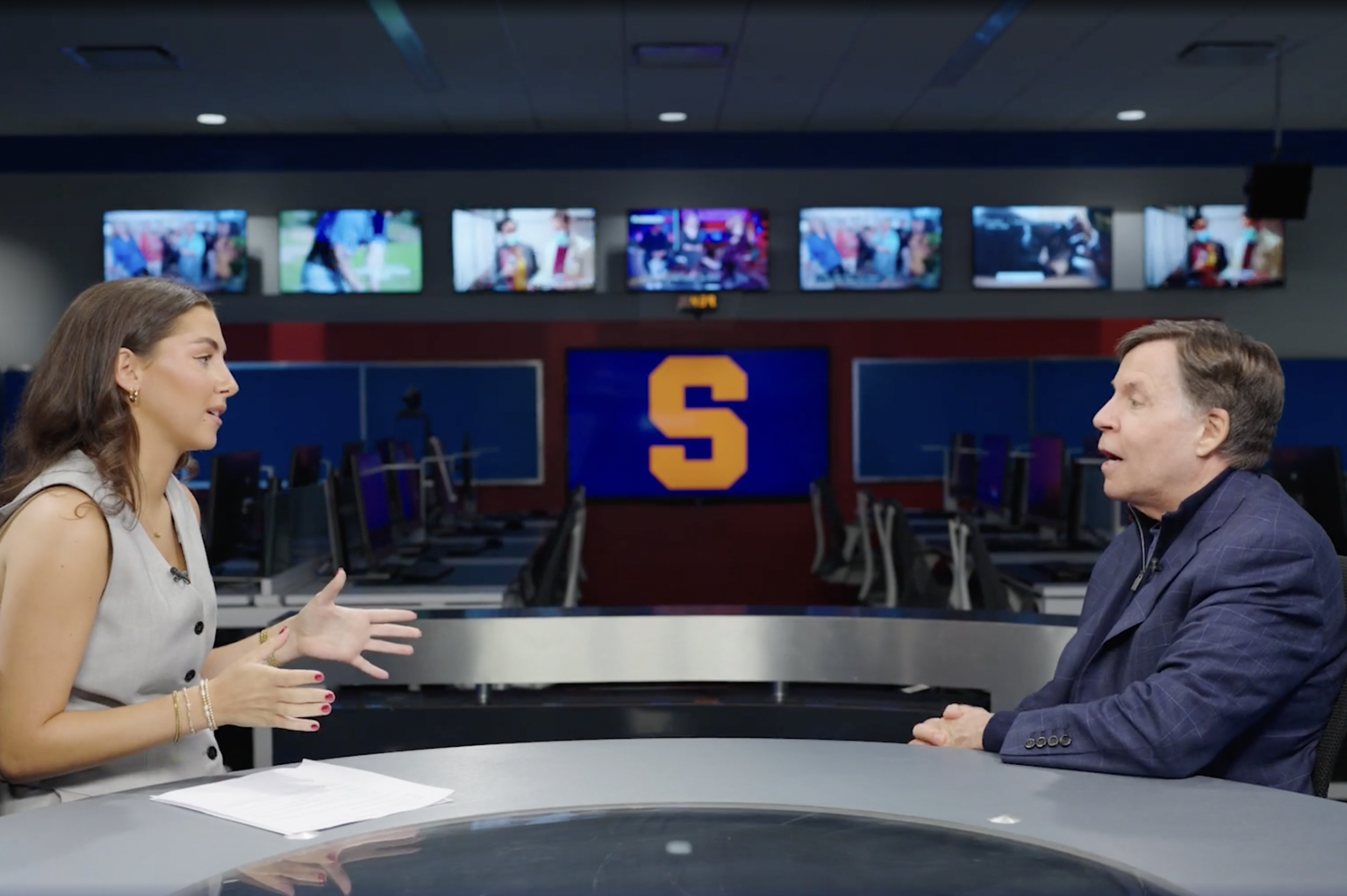 Chloe Smarz interviews Bob Costas in a newsroom