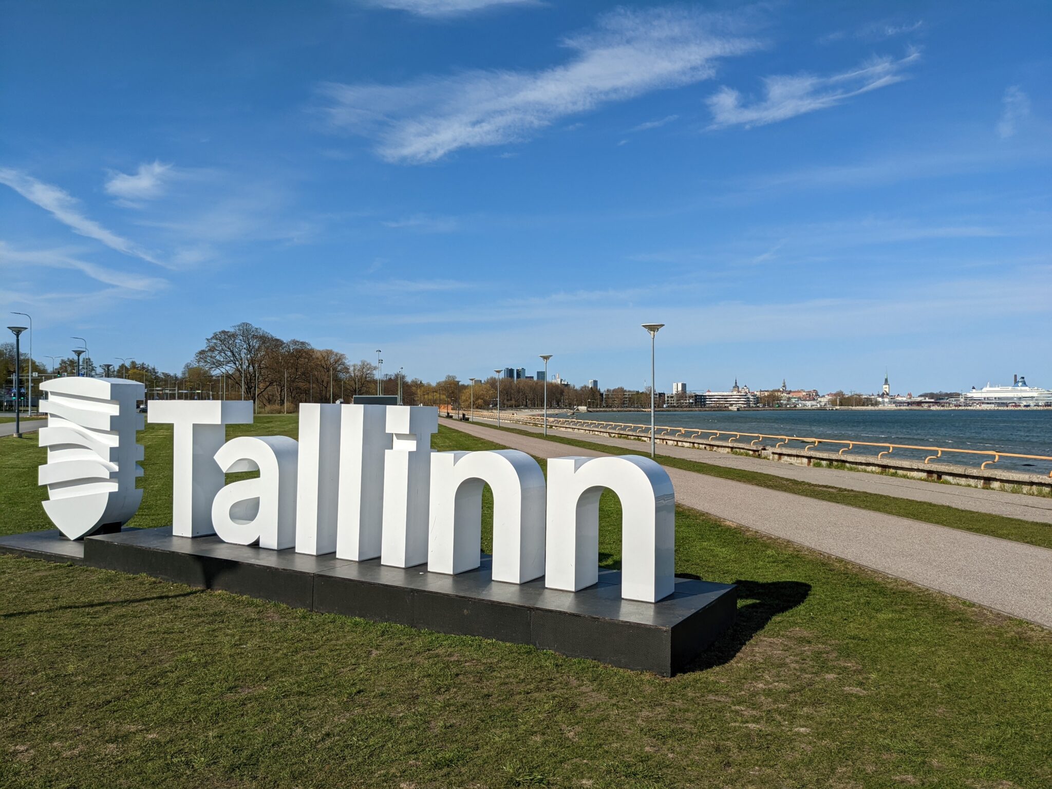 A white sculpture that spells out the name "Tallinn" which is the capital of Estonia