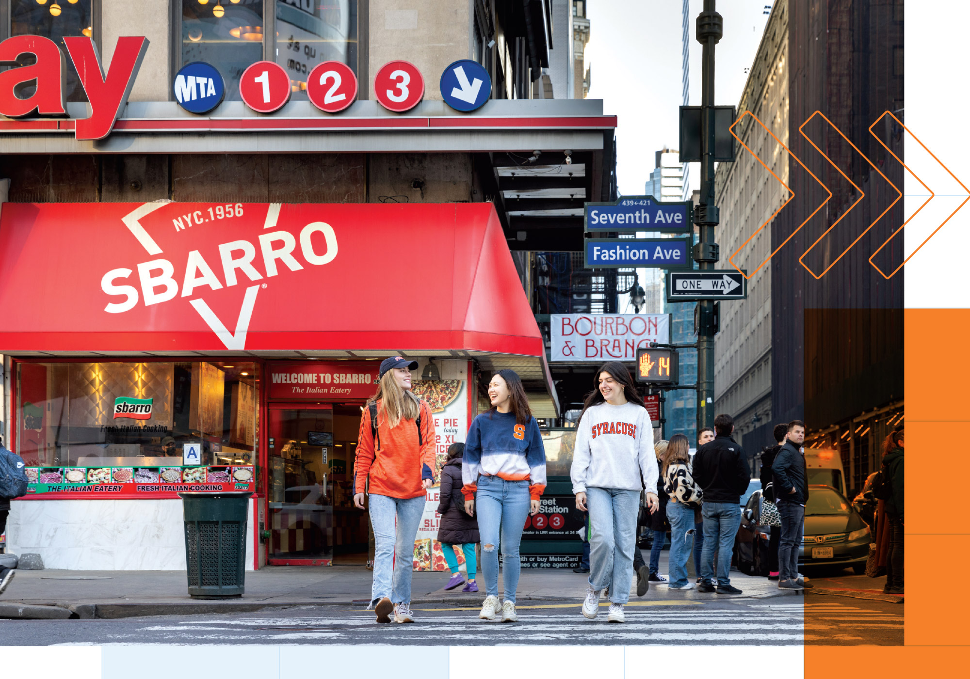 three people walk across the street in front of a Sbarro in New York City