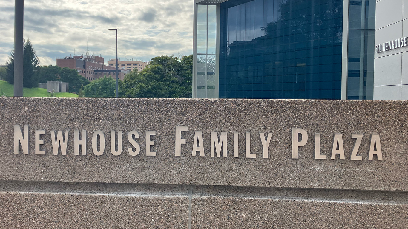 A sign reads "Newhouse Family Plaza"