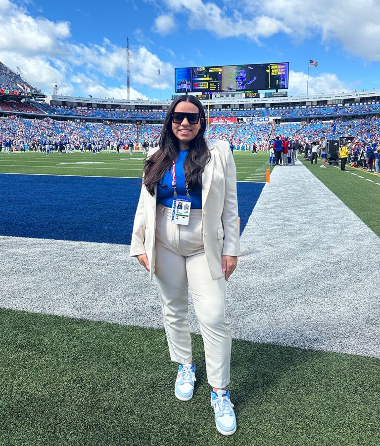 a person stands on a football field