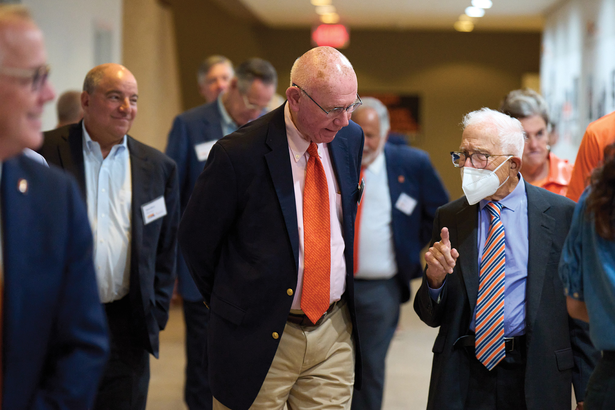 Dean Emeritus David Rubin walks with Donald Newhouse during the school tour.