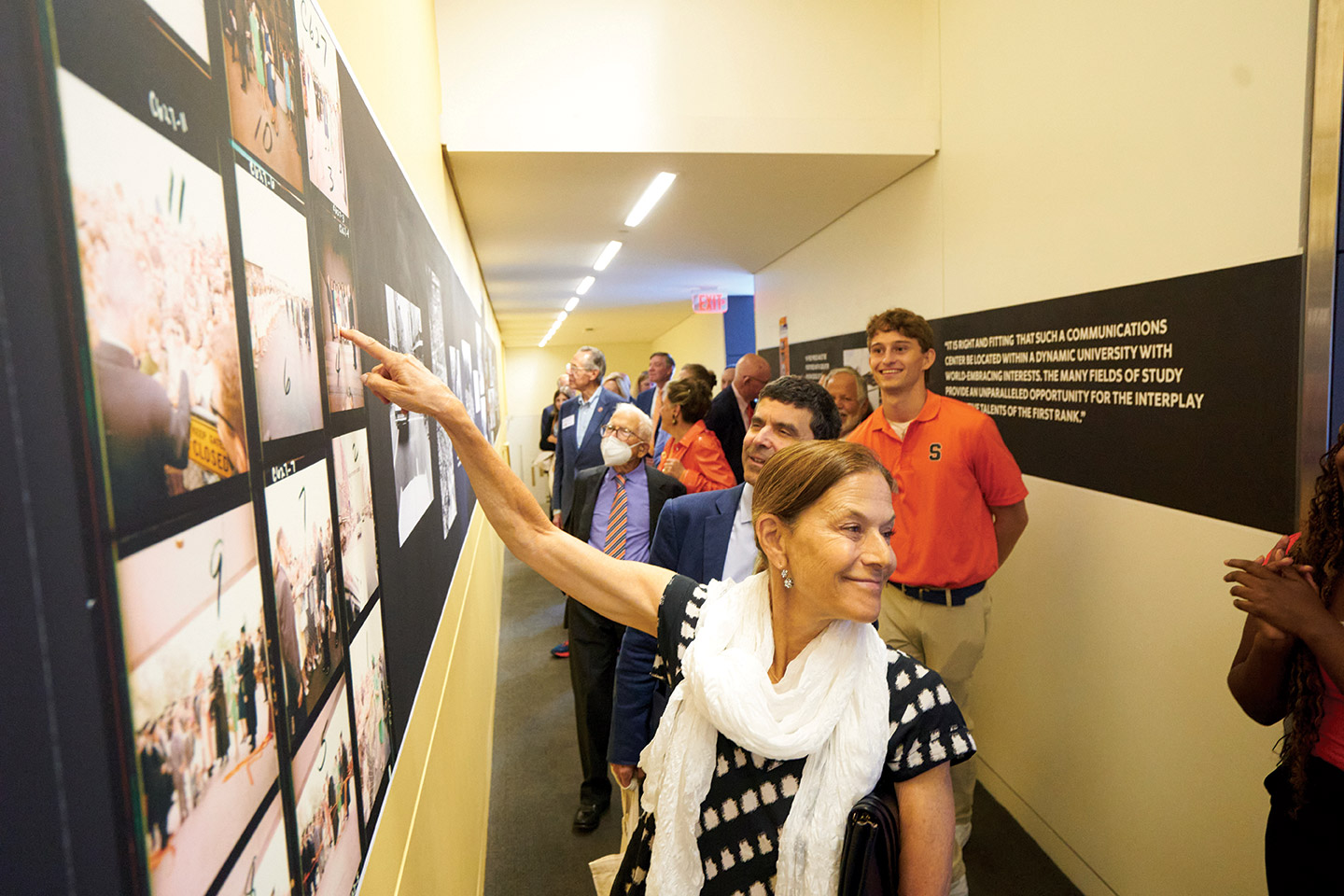 Gina Sanders and other members of the Newhouse family tour the anniversary gallery spaces.