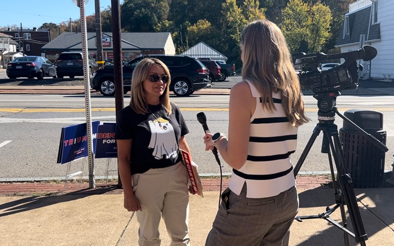 A Newhouse School broadcast journalism student interviews a woman for a presidential campaign story in Pennsylvania