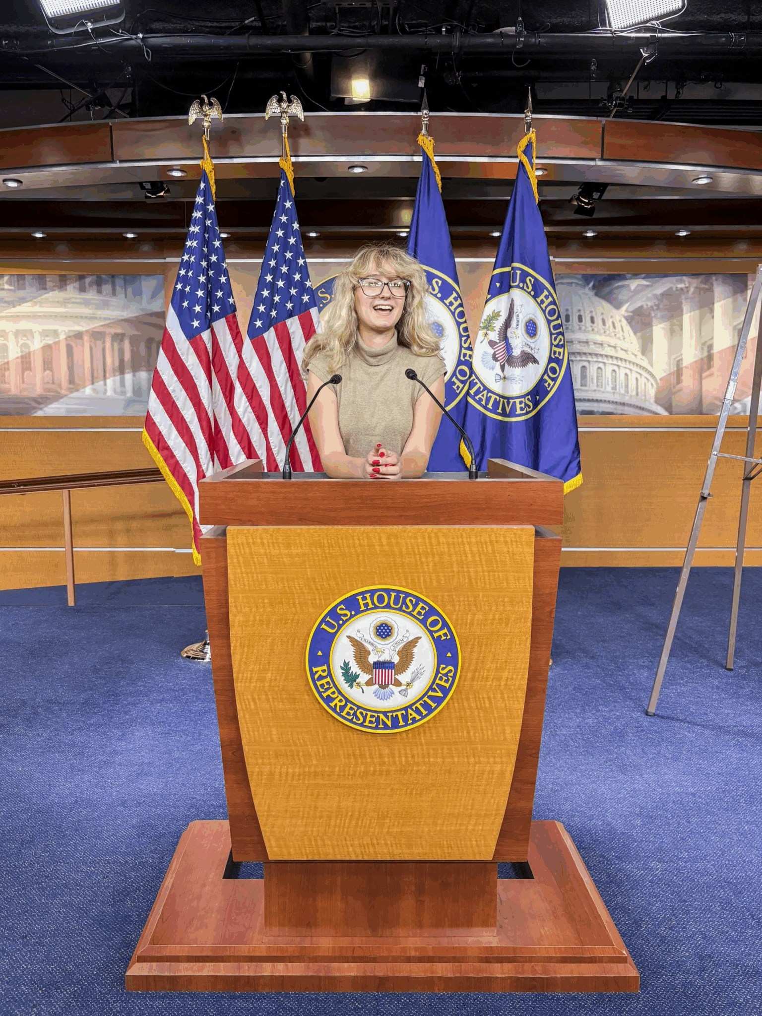a person stands behind the US house of representatives podium